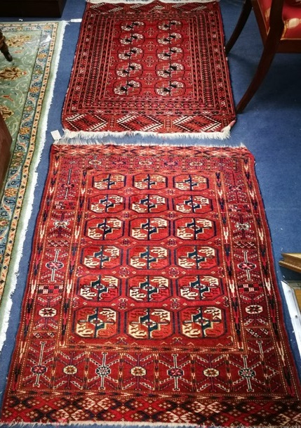 Two Bokhara rugs 110 x 88cm and 118 x 85cm